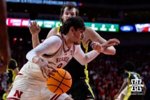 Nebraska Cornhusker forward Berke Büyüktuncel (9) drives along the baseline against Oregon Duck center Nate Bittle (32) in the second half during a college men’s basketball game on Tuesday, Jan. 13, 2026, in Lincoln, Nebraska. Photo by John S. Peterson.