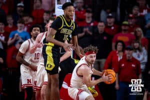 Nebraska Cornhusker guard Sam Hoiberg (1) grabs the rebound against Oregon Duck forward Kwame Evans Jr. (10) in the first half during a college men’s basketball game on Tuesday, Jan. 13, 2026, in Lincoln, Nebraska. Photo by John S. Peterson.