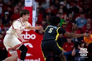 Nebraska Cornhusker forward Braden Frager (5) defends against Oregon Duck guard Takai Simpkins (5) driving to the basket in the first half during a college men’s basketball game on Tuesday, Jan. 13, 2026, in Lincoln, Nebraska. Photo by John S. Peterson.