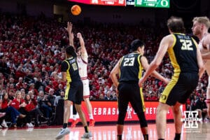 Nebraska Cornhusker forward Braden Frager (5) makes a three point shot against Oregon Duck forward Kwame Evans Jr. (10) in the first half during a college men’s basketball game on Tuesday, Jan. 13, 2026, in Lincoln, Nebraska. Photo by John S. Peterson.
