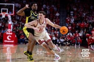 Nebraska Cornhusker forward Pryce Sandfort (21) dribbles the ball against Oregon Duck forward Sean Stewart (13) in the first half during a college men’s basketball game on Tuesday, Jan. 13, 2026, in Lincoln, Nebraska. Photo by John S. Peterson.