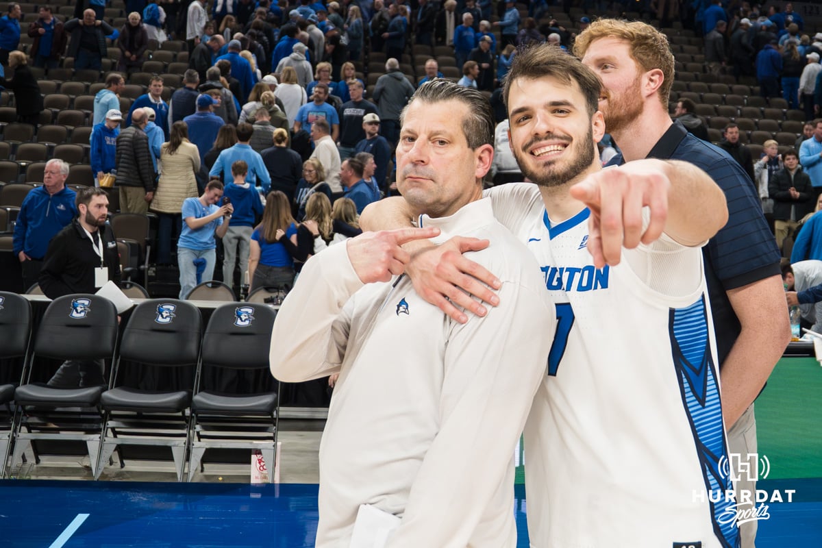Creighton Bluejay Fedor Žugić (7) and assistant coach Derek Kellogg pose for a photo after a college basketball game against Georgetown on Jan 13, 2026, in Omaha, Nebraska. Photo by Brandon Tiedemann