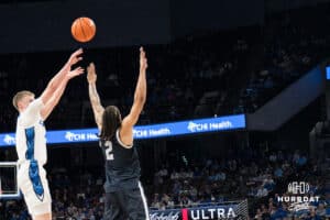 Creighton Bluejay Josh Dix (4) shoots a three pointer over Malik Mack (2) during a college basketball game against Georgetown on Jan 13, 2026, in Omaha, Nebraska. Photo by Brandon Tiedemann