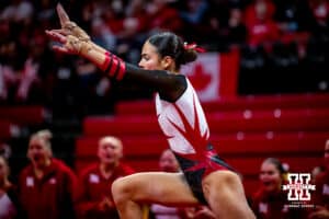 Nebraska Cornhusker Isabel Sikon performs on the floor with her teammates cheering during the Ameritas Master’s Classic women's gymnastics meet on Saturday, Jan. 10, 2026, in Lincoln, Nebraska. Photo by Braden Cochran.