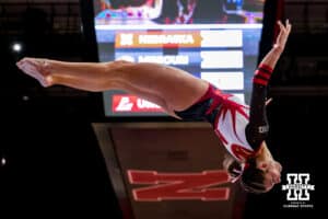 Nebraska Cornhusker Whitney Jenks flips in the air in her beam routine during the Ameritas Master’s Classic women's gymnastic meet on Saturday, Jan. 10, 2026, in Lincoln, Nebraska. Photo by Braden Cochran.