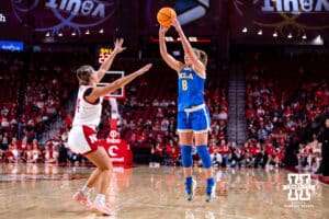 UCLA Bruin guard Gianna Kneepkens (8) makes a three-point shot againt Nebraska Cornhusker guard Callin Hake (14) in the third quarter during a college women’s basketball game on Sunday, Jan. 11, 2026, in Lincoln, Nebraska. Photo by John S. Peterson.