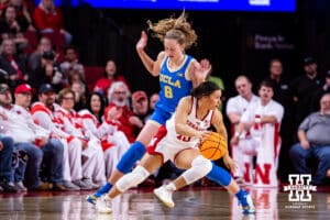 Nebraska Cornhusker guard Kennadi Williams (15) dribbles the ball against UCLA Bruin guard Gianna Kneepkens (8) in the third quarter during a college women’s basketball game on Sunday, Jan. 11, 2026, in Lincoln, Nebraska. Photo by John S. Peterson.