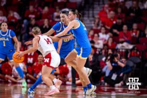 Nebraska Cornhusker guard Callin Hake (14) dribbles the ball against UCLA Bruin center Lauren Betts (51) and forward Gabriela Jaquez (11) in the second half during a college women’s basketball game on Sunday, Jan. 11, 2026, in Lincoln, Nebraska. Photo by John S. Peterson.