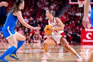 Nebraska Cornhusker guard Callin Hake (14) dribbles the ball against UCLA Bruin forward Angela Dugalić (32) during a college women’s basketball game on Sunday, Jan. 11, 2026, in Lincoln, Nebraska. Photo by John S. Peterson.
