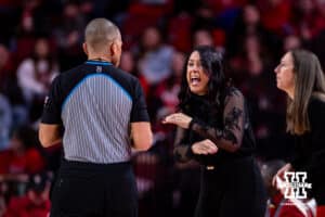 Nebraska Cornhusker head coach Amy Williams shares her thoughts with the referee against the UCLA Bruins in the first half during a college women’s basketball game on Sunday, Jan. 11, 2026, in Lincoln, Nebraska. Photo by John S. Peterson.