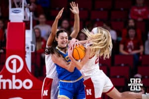 Nebraska Cornhusker guard Britt Prince (23) fights for the ball against UCLA Bruin forward Angela Dugalić (32) in the first half during a college women’s basketball game on Sunday, Jan. 11, 2026, in Lincoln, Nebraska. Photo by John S. Peterson.