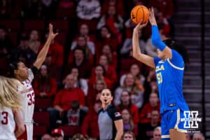 UCLA Bruin center Lauren Betts (51) make a three point shot agianst Nebraska Cornhusker forward Amiah Hargrove (33) in the first half during a college women’s basketball game on Sunday, Jan. 11, 2026, in Lincoln, Nebraska. Photo by John S. Peterson.