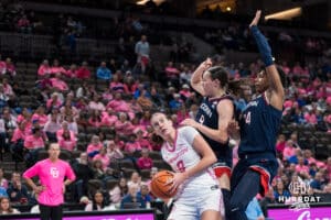 Creighton Bluejay Tara Dacic (9) tries to get past two defenders during a college basketball game against UCONN on Jan 11, 2026 in Omaha, Nebraska. Photo by Brandon Tiedemann