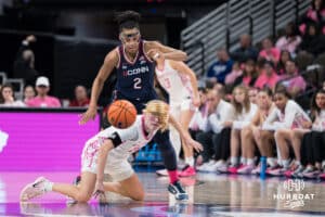 Creighton Bluejay Ava Zediker (24) goes after a loose ball during a college basketball game against UCONN on Jan 11, 2026 in Omaha, Nebraska. Photo by Brandon Tiedemann
