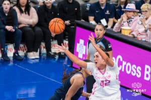 Creighton Bluejay Grace Boffeli (42) tries to grab a rebound over Sarah Strong (21) during a college basketball game against UCONN on Jan 11, 2026 in Omaha, Nebraska. Photo by Brandon Tiedemann