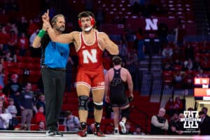At HWT: #4 Nebraska Cornhusker AJ Ferrari celebrates a win against Hayden Filipovich, Ferrari wins by major decision 11-2 during a college wrestling match on Friday, Jan. 9, 2026, in Lincoln, Nebraska. Photo by John S. Peterson.