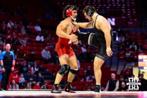 At HWT: #4 Nebraska Cornhusker AJ Ferrari works a leg against Hayden Filipovich, Ferrari wins by major decision 11-2 during a college wrestling match on Friday, Jan. 9, 2026, in Lincoln, Nebraska. Photo by John S. Peterson.
