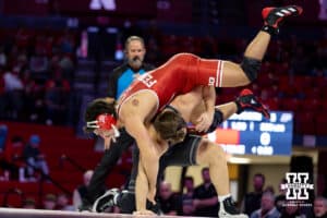 At HWT: #4 Nebraska Cornhusker AJ Ferrari gets throw off Hayden Filipovich's back, Ferrari wins by major decision 11-2 during a college wrestling match on Friday, Jan. 9, 2026, in Lincoln, Nebraska. Photo by John S. Peterson.