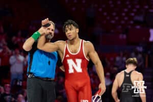 At 174: #6 Nebraska Cornhusker Christopher Minto celebrates the win over #16 Purdue Boilermaker Brody Baumann, Minto wins by decision 11-8 during a college wrestling match on Friday, Jan. 9, 2026, in Lincoln, Nebraska. Photo by John S. Peterson.
