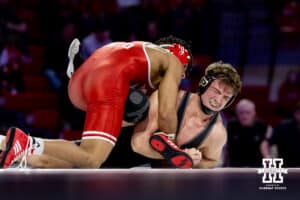 At 174: #6 Nebraska Cornhusker Christopher Minto applies some pressure to the hip against #16 Purdue Boilermaker Brody Baumann, Minto wins by decision 11-8 during a college wrestling match on Friday, Jan. 9, 2026, in Lincoln, Nebraska. Photo by John S. Peterson.