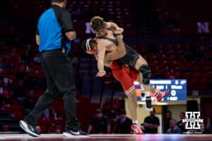 At 174: #6 Nebraska Cornhusker Christopher Minto throws #16 Purdue Boilermaker Brody Baumann, Minto wins by decision 11-8 during a college wrestling match on Friday, Jan. 9, 2026, in Lincoln, Nebraska. Photo by John S. Peterson.