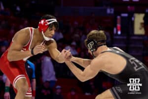 At 174: #6 Nebraska Cornhusker Christopher Minto looking for the move against #16 Purdue Boilermaker Brody Baumann, Minto wins by decision 11-8 during a college wrestling match on Friday, Jan. 9, 2026, in Lincoln, Nebraska. Photo by John S. Peterson.