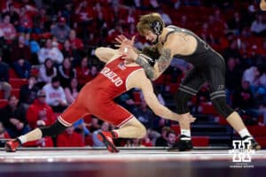 At 165: #8 Nebraska Cornhuskers LJ Araujo shoots for a leg against #4 Purdue Boilermakers Joey Blaze, Blaze wins by decision 8-2 during a college wrestling match on Friday, Jan. 9, 2026, in Lincoln, Nebraska. Photo by John S. Peterson.