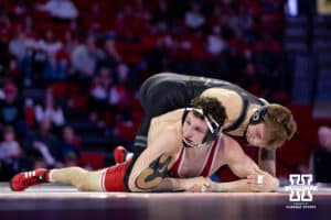At 165: #8 Nebraska Cornhuskers LJ Araujo hold the leg against #4 Purdue Boilermakers Joey Blaze, Blaze wins by decision 8-2 during a college wrestling match on Friday, Jan. 9, 2026, in Lincoln, Nebraska. Photo by John S. Peterson.