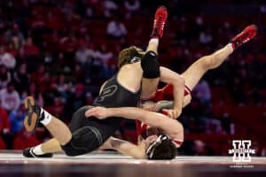 At 165: #4 Purdue Boilermakers Joey Blaze gets #8 Nebraska Cornhuskers LJ Araujo on his back, Blaze wins by decision 8-2 during a college wrestling match on Friday, Jan. 9, 2026, in Lincoln, Nebraska. Photo by John S. Peterson.