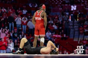 At 157: #5 Nebraska Cornhusker Antrell Taylor celebrates the pin against #19 Purdue Boilermaker Stoney Buell (P), Taylor pins Buell in 2:51 during a college wrestling match on Friday, Jan. 9, 2026, in Lincoln, Nebraska. Photo by John S. Peterson.