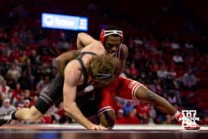 At 157: #5 Nebraska Cornhusker Antrell Taylor works on #19 Purdue Boilermaker Stoney Buell (P), Taylor pins Buell in 2:51 during a college wrestling match on Friday, Jan. 9, 2026, in Lincoln, Nebraska. Photo by John S. Peterson.