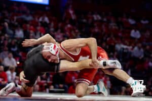 At 141: #3 Nebraska Cornhusker Brock Hardy gets the leg for a take down against Purdue Boilermaker Vincent Paino, Hardy wins by pin in 3:54, during a college wrestling match on Friday, Jan. 9, 2026, in Lincoln, Nebraska. Photo by John S. Peterson.