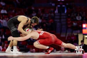 At 133: #8 Nebraska Cornhusker Jacob Van Dee shoots for a leg against Blake Boarman, Van Dee wins by major decision 13-2 during a college wrestling match on Friday, Jan. 9, 2026, in Lincoln, Nebraska. Photo by John S. Peterson.