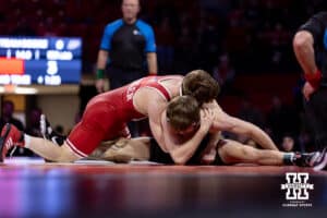 At 125: Nebraska Cornhusker Alan Koehler makes Purdue Boilermaker Ashton Jackson do the splits, Koekler wins by decision 9-3 during a college wrestling match on Friday, Jan. 9, 2026, in Lincoln, Nebraska. Photo by John S. Peterson.