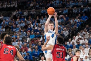 Creighton Bluejay Josh Dix (4) shoots over Lefteris Liotopoulos (31) during a college basketball game against St. John’s on Jan 10, 2026 in Omaha, Nebraska. Photo by Brandon Tiedemann