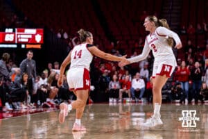 Nebraska Cornhusker guard Callin Hake (14) gets five from guard Logan Nissley (2) after making a basket against the Indiana Hoosiers during a college women’s basketball game on Thursday, Jan. 8, 2026, in Lincoln, Nebraska. Photo by John S. Peterson.
