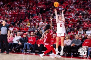 Nebraska Cornhusker guard Logan Nissley (2) makes a three point shot against Indiana Hoosier guard Jerni Kiaku (7) during a college women’s basketball game on Thursday, Jan. 8, 2026, in Lincoln, Nebraska. Photo by John S. Peterson.