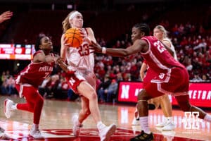 Nebraska Cornhusker guard Britt Prince (23) drives to the basket against Indiana Hoosier guard Jerni Kiaku (7) and forward Zania Socka-Nguemen (23) during a college women’s basketball game on Thursday, Jan. 8, 2026, in Lincoln, Nebraska. Photo by John S. Peterson.
