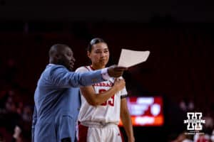 Nebraska Cornhusker guard Britt Prince (23) talks to assistant coach Julian Assibey against the Indiana Hoosiers during a college women’s basketball game on Thursday, Jan. 8, 2026, in Lincoln, Nebraska. Photo by John S. Peterson.