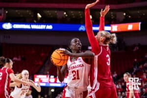 Nebraska Cornhusker forward Eliza Maupin (21) makes a layup against Indiana Hoosier guard Lenée Beaumont (5) during a college women’s basketball game on Thursday, Jan. 8, 2026, in Lincoln, Nebraska. Photo by John S. Peterson.