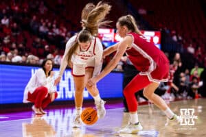 Nebraska Cornhusker guard Logan Nissley (2) gets tripped up by Indiana Hoosier guard Lenée Beaumont (5) during a college women’s basketball game on Thursday, Jan. 8, 2026, in Lincoln, Nebraska. Photo by John S. Peterson.