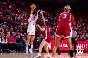 Nebraska Cornhusker guard Logan Nissley (2) makes a three point shot against Indiana Hoosier guard Nevaeh Caffey (2) during a college women’s basketball game on Thursday, Jan. 8, 2026, in Lincoln, Nebraska. Photo by John S. Peterson.