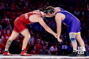 At HWT, Nebraska Cornhusker Harley Andrews controls the wrist against Northern Iowa Panther Adam Ahrendsen during a college wrestling match. Andrews won by major decision against Ahrendsen 16-7 on Saturday, Jan. 3, 2026, in Lincoln, Nebraska. Photo by John S. Peterson.