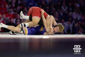 At 184, #9 Nebraska's Silas Allred works on getting back points against Northern Iowa's Nick Fox during a college wrestling match on Saturday, Jan. 3, 2026, in Lincoln, Nebraska. Allred wins by decision, 5-1. Photo by John S. Peterson.