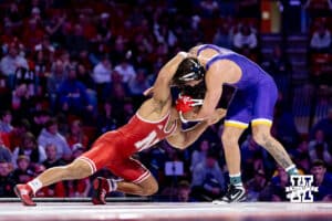 At 174, No. 6 Nebraska Cornhusker Chris Minto shoots for a leg against No. 10 Northern Iowa Panther Jared Simma during a college wrestling match. Minto wins by major decision over Simma on Saturday, Jan. 3, 2026, in Lincoln, Nebraska. Minto wins by a major decision. Photo by John S. Peterson.