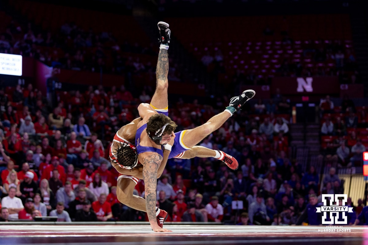 At 174, No. 6 Nebraska Cornhusker Chris Minto throws No. 10 Northern Iowa Panther Jared Simma during a college wrestling match. Minto wins by major decision over Simma on Saturday, Jan. 3, 2026, in Lincoln, Nebraska. Minto wins by a major decision. Photo by John S. Peterson.