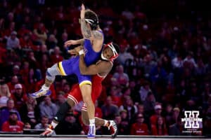 At 157, #5 Nebraska's Antrell Taylor tries to throw Northern Iowa's RJ Weston during a college wrestling match on Saturday, Jan. 3, 2026, in Lincoln, Nebraska. Taylor wins by technical fall 22-6. Photo by John S. Peterson.