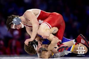 At 149, Nebraska #12 Chance Lamer pushes on Northern Iowa's Ethan Basile head during a college wrestling match on Saturday, Jan. 3, 2026, in Lincoln, Nebraska. Lamer wins by technical fall 19-4. Photo by John S. Peterson.