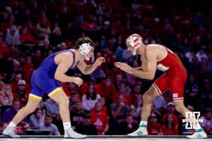 At 141, #3 Nebraska's Brock Hardy and #11 Northern Iowa's Cory Land are working a takedown during a college wrestling match on Saturday, Jan. 3, 2026, in Lincoln, Nebraska. Photo by John S. Peterson.