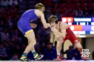 At 125, no. 27 Nebraska Cornhusker Trever Anderson takes on Northern Iowa Panther Alan Koehler during a college wrestling match. Koehler won by decision over Anderson 5-2 on Saturday, Jan. 3, 2026, in Lincoln, Nebraska. Photo by John S. Peterson.